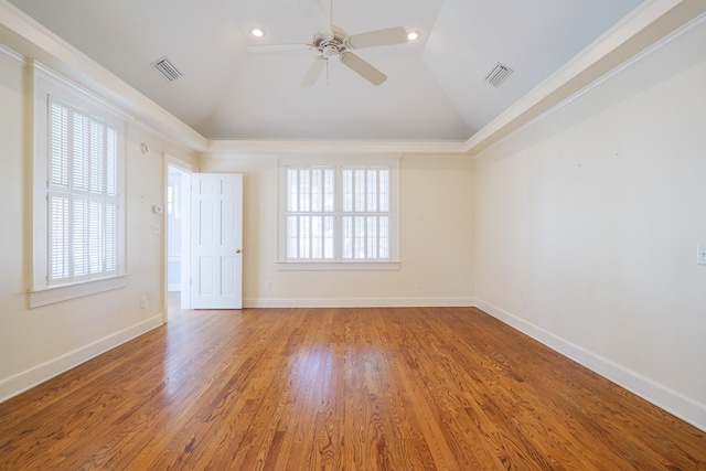 empty room with lofted ceiling, baseboards, and light wood finished floors