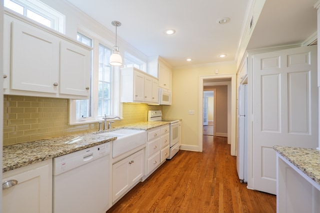 kitchen with light wood-style flooring, white appliances, a sink, white cabinetry, and ornamental molding