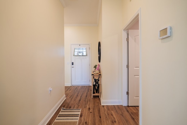 corridor with crown molding and dark hardwood / wood-style floors