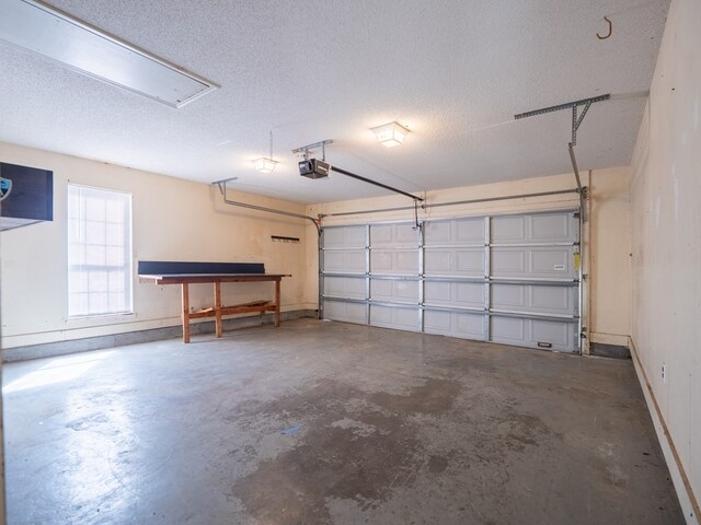5210 N Northridge Rd, Valdosta, GA 31605 - garage featuring a garage door opener and baseboards