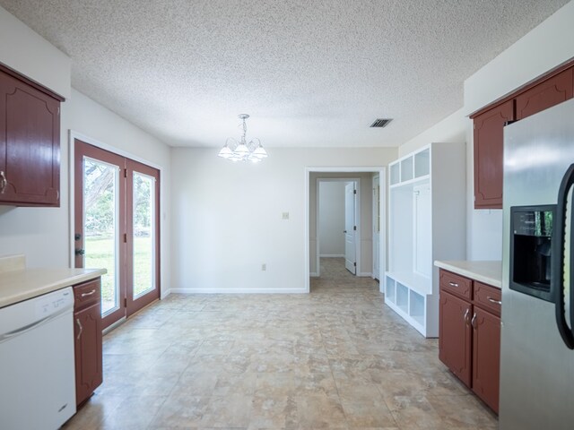 5210 N Northridge Rd, Valdosta, GA 31605 - kitchen featuring light countertops, a chandelier, white dishwasher, stainless steel refrigerator with ice dispenser, and visible vents