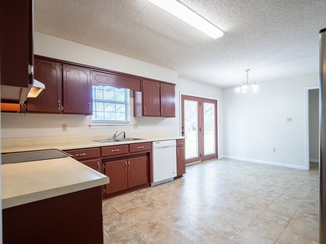 5210 N Northridge Rd, Valdosta, GA 31605 - kitchen featuring light countertops, dishwasher, a sink, pendant lighting, and a notable chandelier