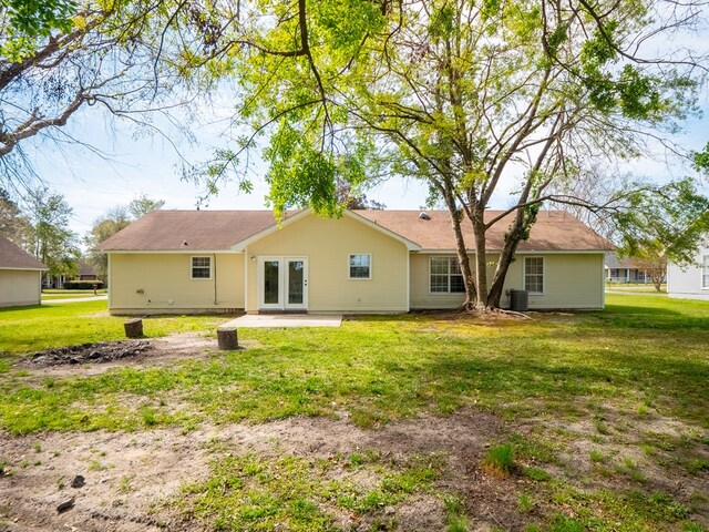 5210 N Northridge Rd, Valdosta, GA 31605 - back of property featuring french doors, central AC unit, a yard, and a patio area