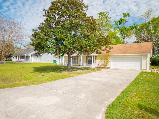 5210 N Northridge Rd, Valdosta, GA 31605 - view of front of property featuring a porch, a front yard, concrete driveway, and an attached garage