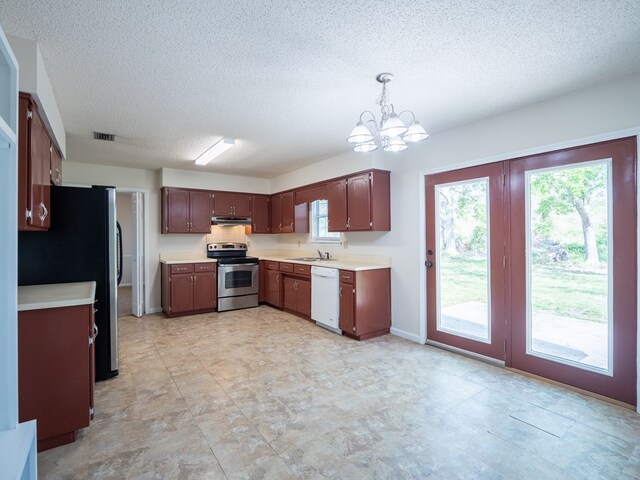 5210 N Northridge Rd, Valdosta, GA 31605 - kitchen with light countertops, stainless steel appliances, under cabinet range hood, a chandelier, and visible vents