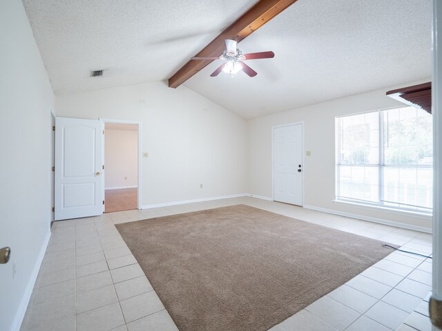 5210 N Northridge Rd, Valdosta, GA 31605 - interior space featuring a textured ceiling, visible vents, ceiling fan, vaulted ceiling with beams, and light tile patterned floors