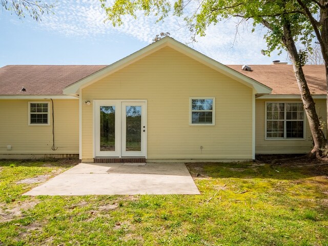 5210 N Northridge Rd, Valdosta, GA 31605 - back of property featuring a lawn and a patio