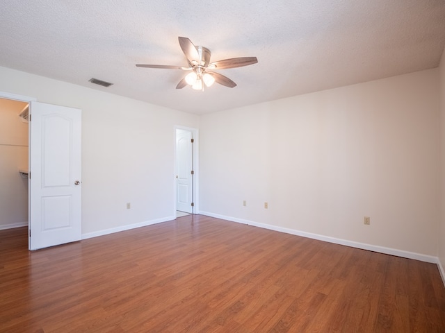 5210 N Northridge Rd, Valdosta, GA 31605 - spare room with a textured ceiling, visible vents, a ceiling fan, and wood finished floors