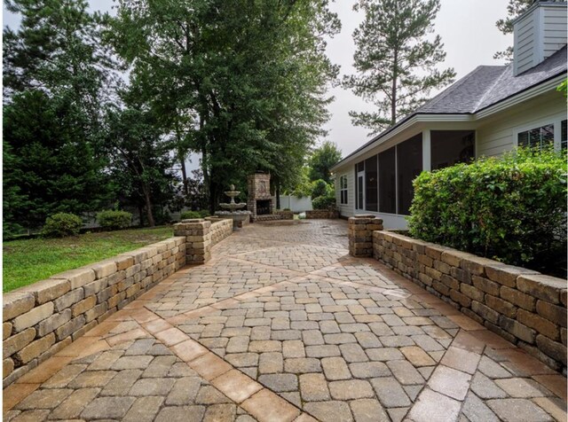 4311 Mossy Creek Rd, Valdosta, GA 31602 - view of patio featuring a sunroom