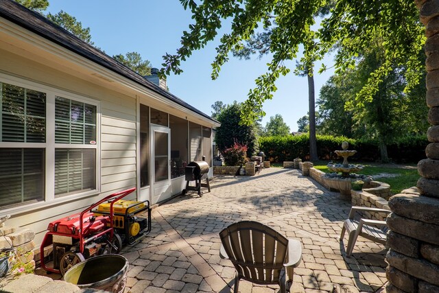 4311 Mossy Creek Rd, Valdosta, GA 31602 - view of patio featuring a sunroom and area for grilling