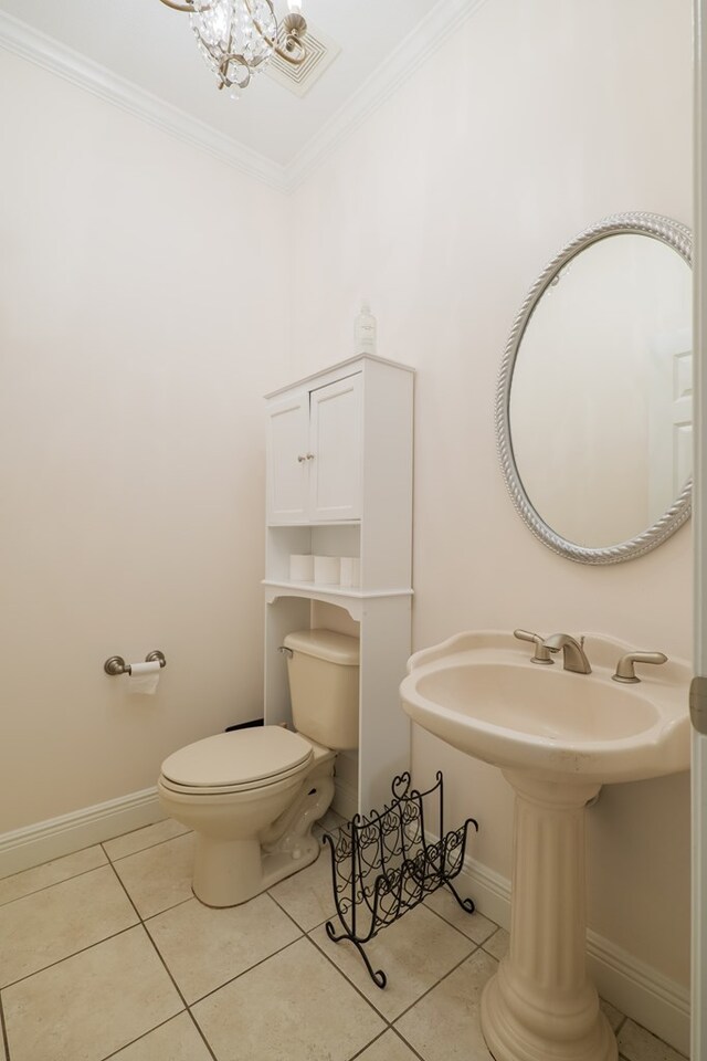 4311 Mossy Creek Rd, Valdosta, GA 31602 - bathroom featuring toilet, tile patterned floors, ornamental molding, baseboards, and a chandelier