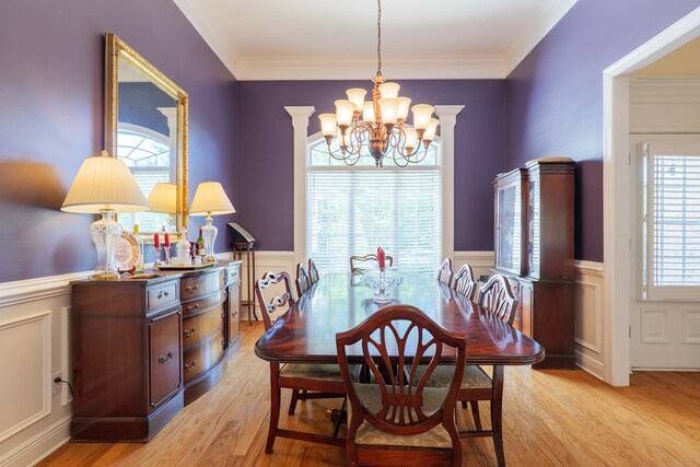4311 Mossy Creek Rd, Valdosta, GA 31602 - dining space with a chandelier, a wainscoted wall, healthy amount of natural light, light wood-type flooring, and a decorative wall