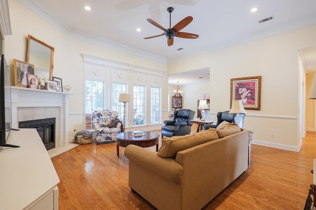 4311 Mossy Creek Rd, Valdosta, GA 31602 - living room featuring a ceiling fan, a fireplace, light wood-style flooring, crown molding, and recessed lighting