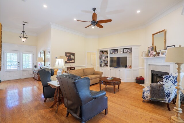 4311 Mossy Creek Rd, Valdosta, GA 31602 - living area featuring a ceiling fan, ornamental molding, light wood finished floors, a tiled fireplace, and recessed lighting