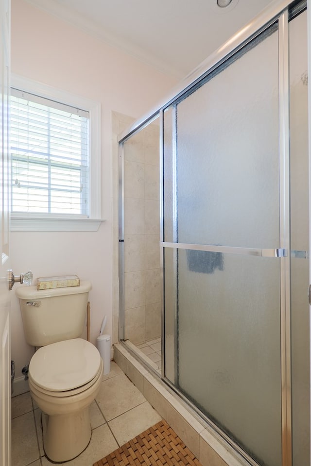 4311 Mossy Creek Rd, Valdosta, GA 31602 - bathroom with toilet, tile patterned flooring, and a shower stall