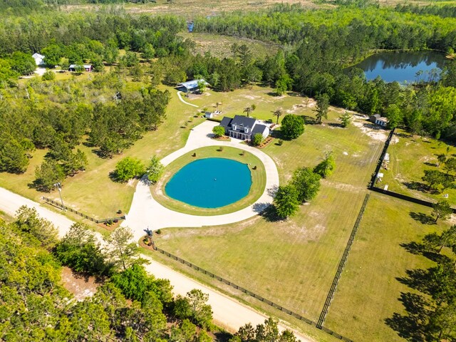 aerial view featuring a view of trees and a water view