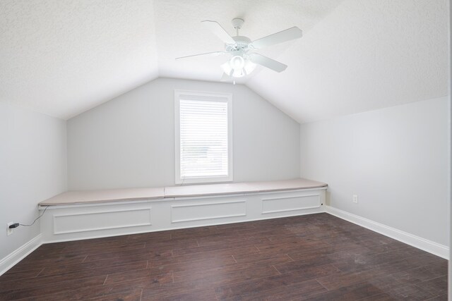 bonus room with ceiling fan, lofted ceiling, wood finished floors, and baseboards