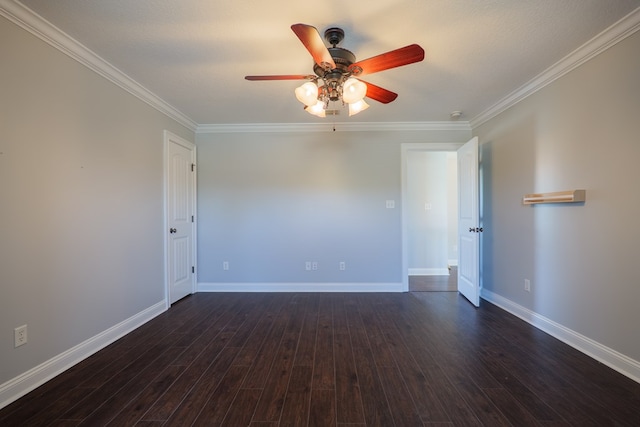 empty room with dark wood finished floors, ornamental molding, and a ceiling fan