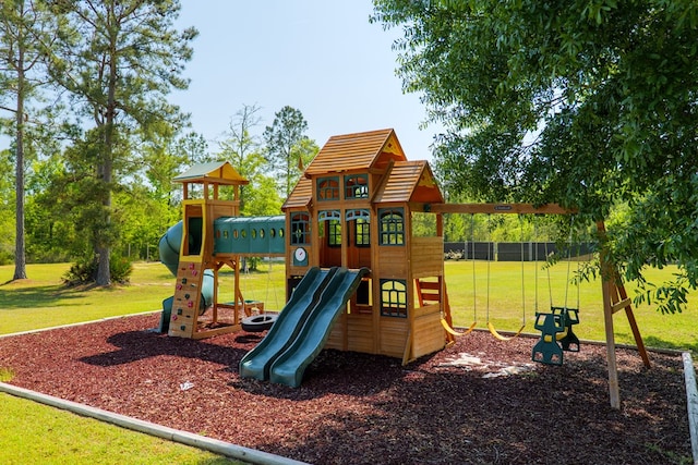 communal playground with a lawn and fence