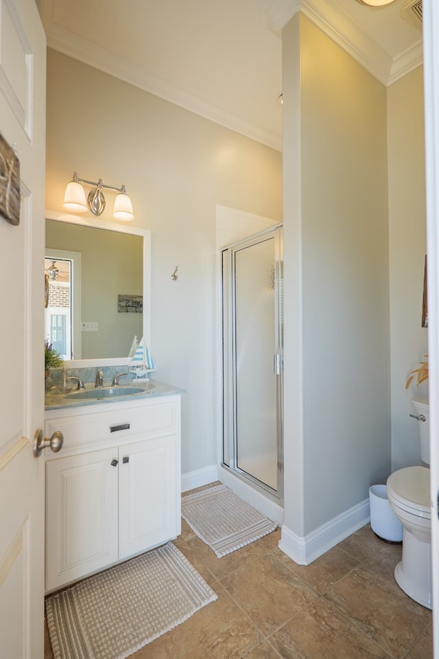 full bathroom featuring a shower stall, toilet, vanity, ornamental molding, and stone finish flooring