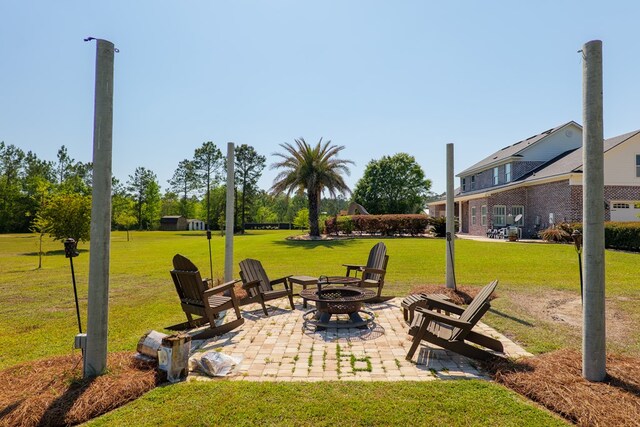 view of yard featuring a patio area and an outdoor fire pit