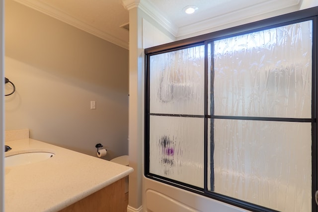 full bathroom with vanity, crown molding, and bath / shower combo with glass door