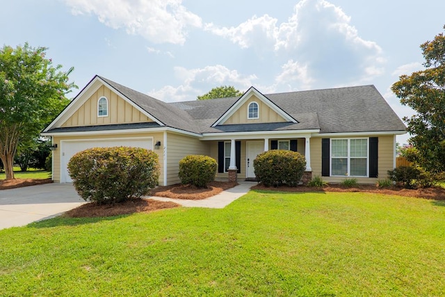 2783 Rabbit Ridge Run, Valdosta, GA 31605 - view of front of home with board and batten siding, concrete driveway, an attached garage, and a front yard