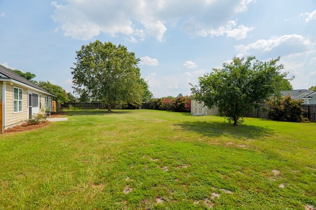2783 Rabbit Ridge Run, Valdosta, GA 31605 - fenced backyard featuring a storage shed