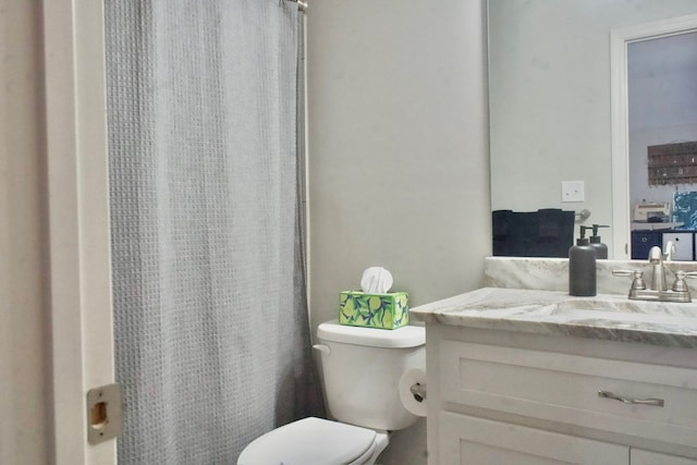 3943 Altman Dr, Valdosta, GA 31605 - full bathroom with a shower with shower curtain, vanity, and toilet