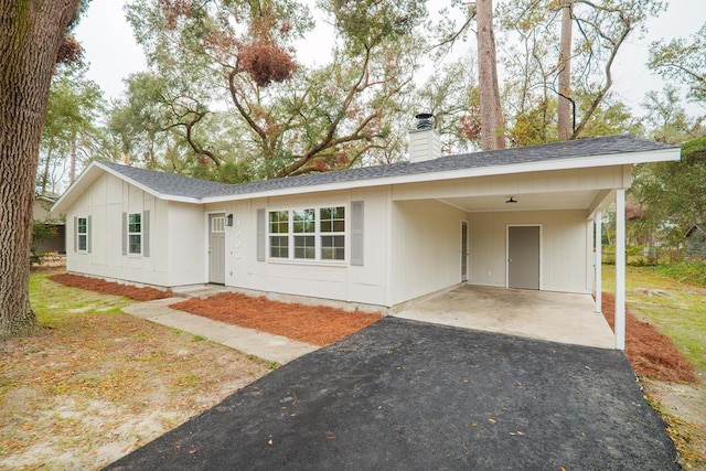 ranch-style house with a carport