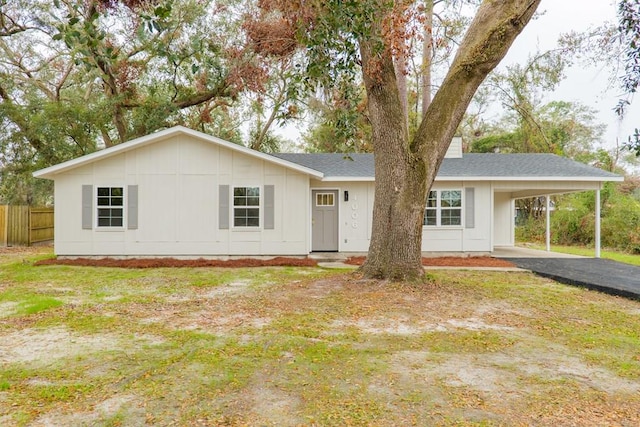 single story home featuring a carport