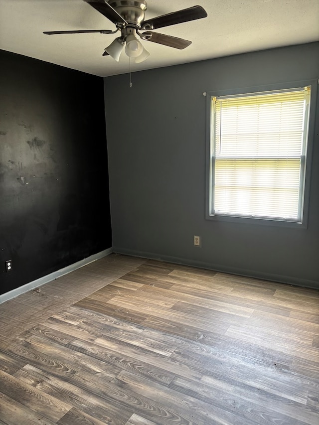 1511 E Moore St, Valdosta, GA 31601 - unfurnished room featuring ceiling fan and wood finished floors
