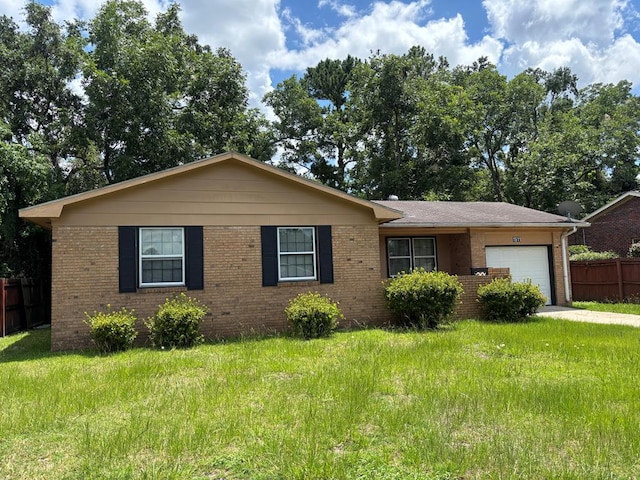 1511 E Moore St, Valdosta, GA 31601 - ranch-style home featuring a garage, brick siding, and driveway