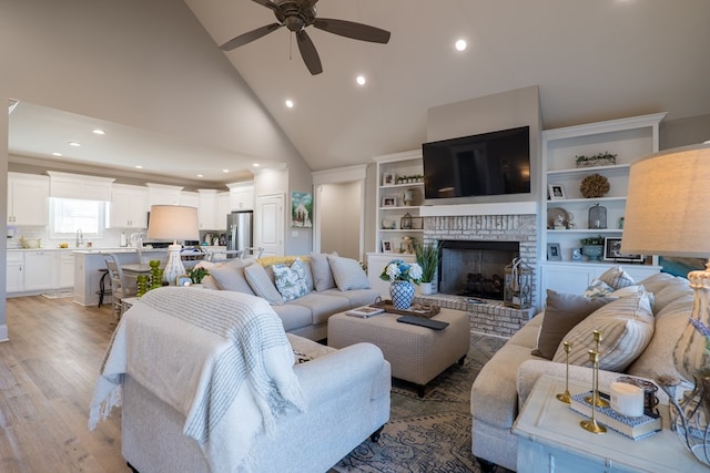 1848 W Marion Ave, Lake Park, GA 31636 - living room featuring a ceiling fan, a brick fireplace, high vaulted ceiling, light wood-style flooring, and recessed lighting