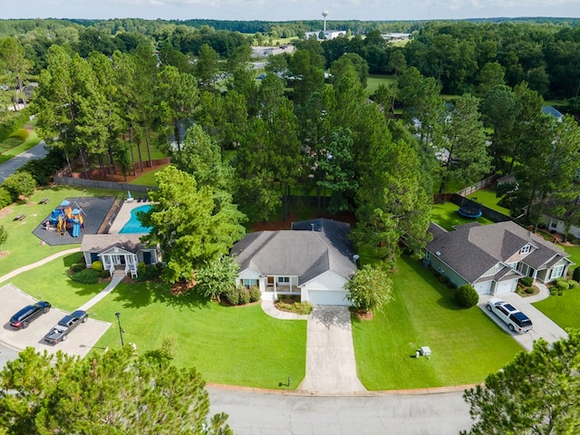 drone / aerial view featuring a view of trees