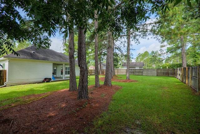 view of yard with a patio and a fenced backyard