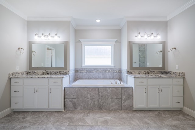 bathroom featuring a relaxing tiled tub, vanity, and crown molding