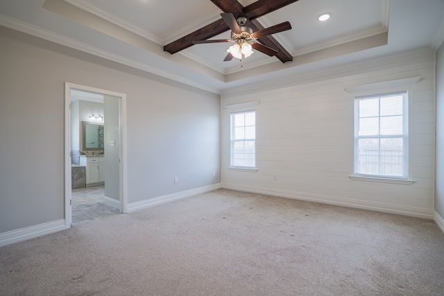 empty room featuring beamed ceiling, coffered ceiling, light colored carpet, ceiling fan, and crown molding