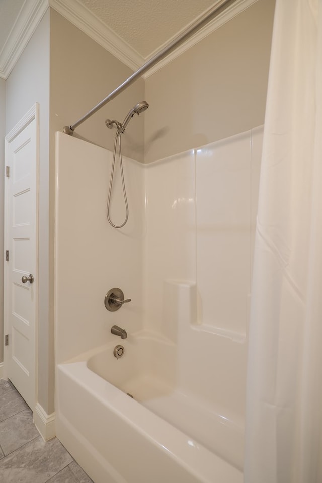 bathroom with crown molding, shower / bathtub combination with curtain, and tile patterned floors