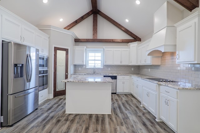 kitchen with white cabinetry, light stone countertops, custom exhaust hood, and stainless steel appliances