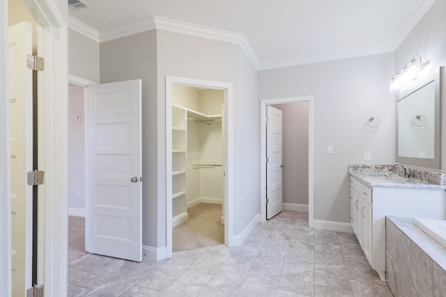 bathroom with crown molding and vanity