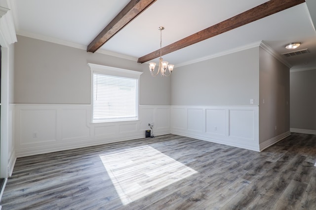 spare room featuring an inviting chandelier, ornamental molding, beam ceiling, and dark wood-type flooring