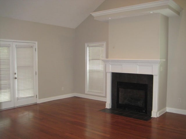 3745 Old Vine Way, Valdosta, GA 31605 - unfurnished living room with wood finished floors, vaulted ceiling, a fireplace, and baseboards