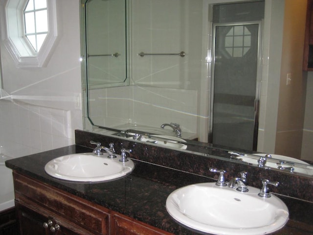 3745 Old Vine Way, Valdosta, GA 31605 - bathroom with backsplash, double vanity, and an enclosed shower