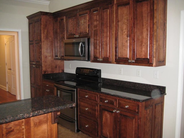 3745 Old Vine Way, Valdosta, GA 31605 - kitchen with appliances with stainless steel finishes, dark stone countertops, and ornamental molding