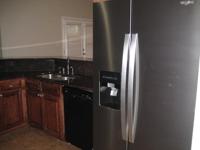 3745 Old Vine Way, Valdosta, GA 31605 - kitchen with stainless steel fridge, black dishwasher, a sink, dark tile patterned flooring, and dark stone countertops