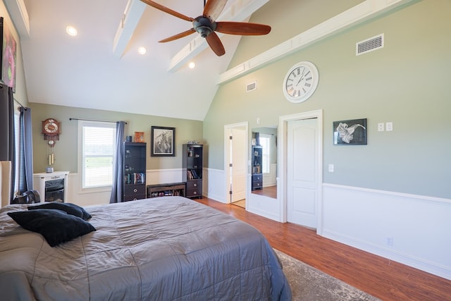 203 Murray Mccranie Rd, Norman Park, GA 31771 - bedroom featuring wood finished floors, wainscoting, beam ceiling, high vaulted ceiling, and ceiling fan