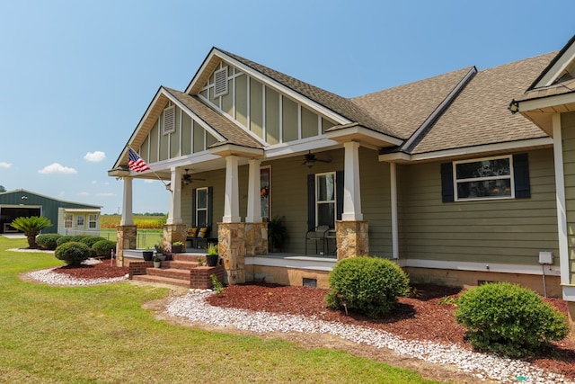 203 Murray Mccranie Rd, Norman Park, GA 31771 - craftsman-style home featuring a ceiling fan, a porch, a shingled roof, a front yard, and board and batten siding