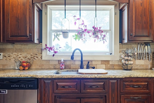 203 Murray Mccranie Rd, Norman Park, GA 31771 - kitchen featuring stainless steel dishwasher, tasteful backsplash, healthy amount of natural light, and light stone counters