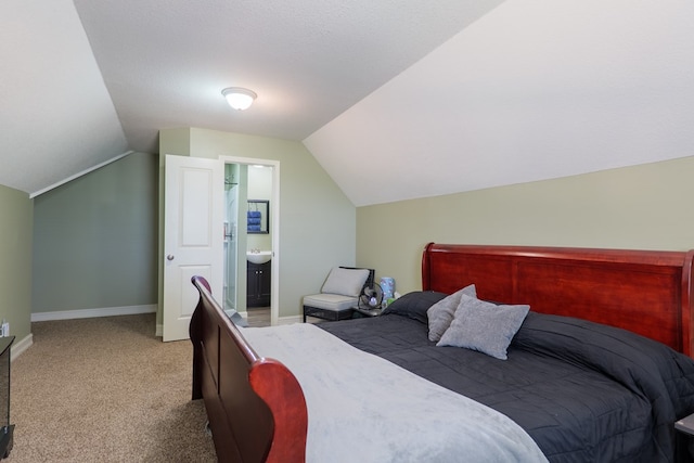 203 Murray Mccranie Rd, Norman Park, GA 31771 - bedroom with light colored carpet, vaulted ceiling, and connected bathroom